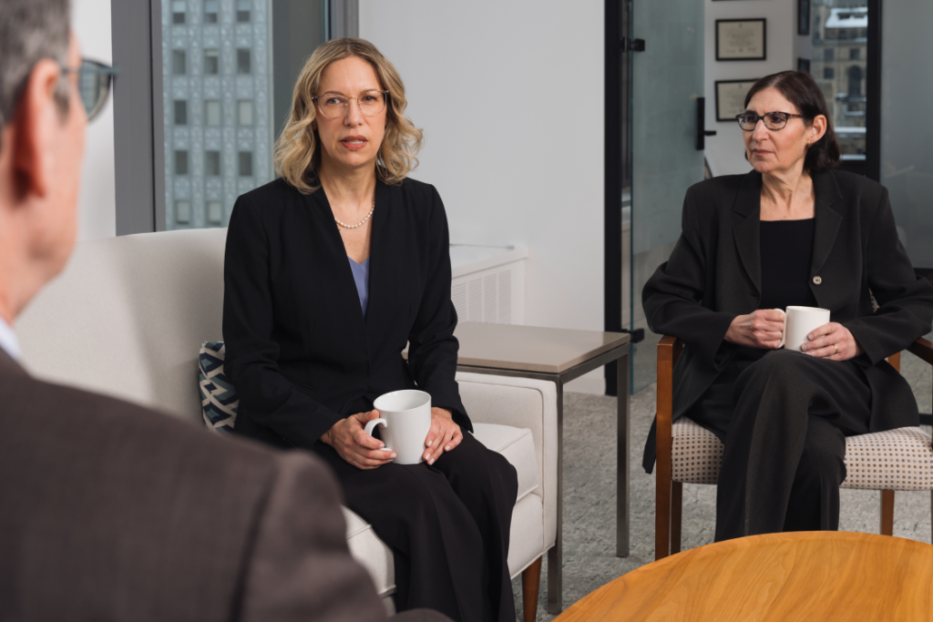 Binder & Schwartz partners discussing a case